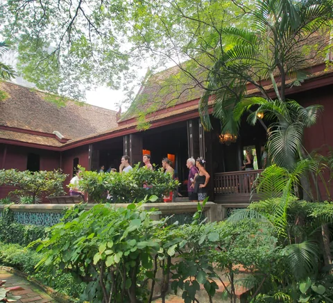 Traditional timber buildings and lush grounds at Jim Thompson House.