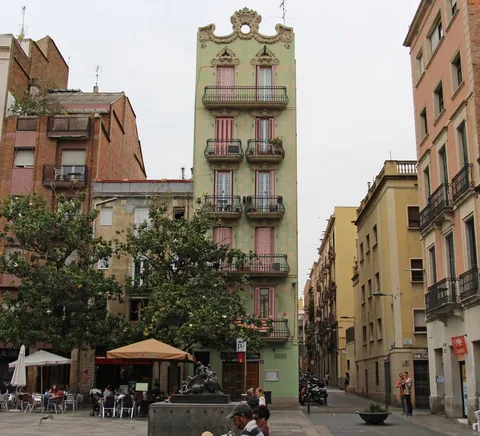 Plaça del Sol, Gràcia: neighbourhood facades, outdoor café tables and local square life.
