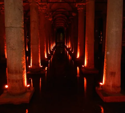 Basilica Cistern columns and visitor walkway lit red.