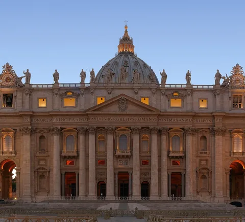 St Peter’s Basilica facade and dome at blue hour.